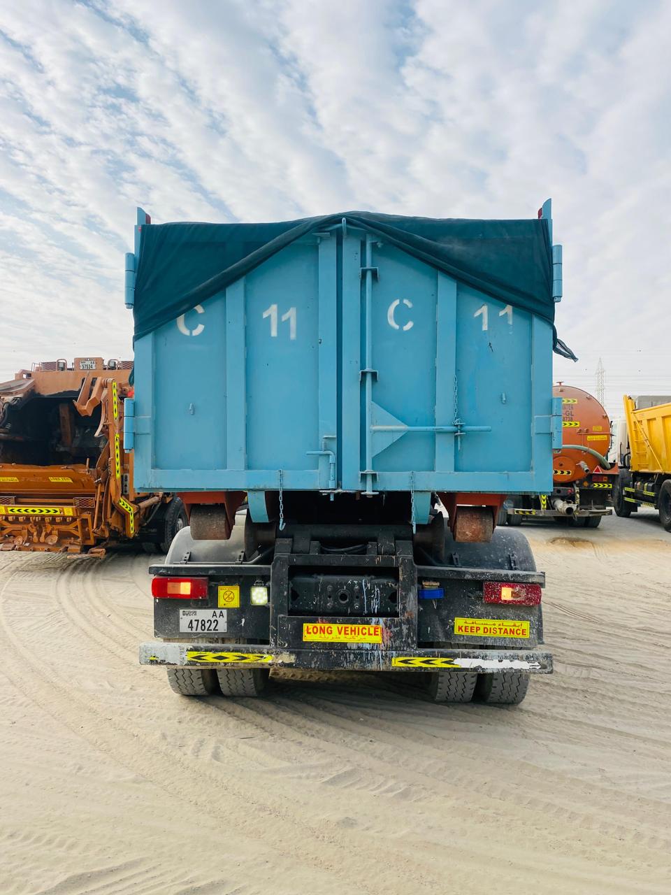 Rear view of GPh blue skip container marked C 11